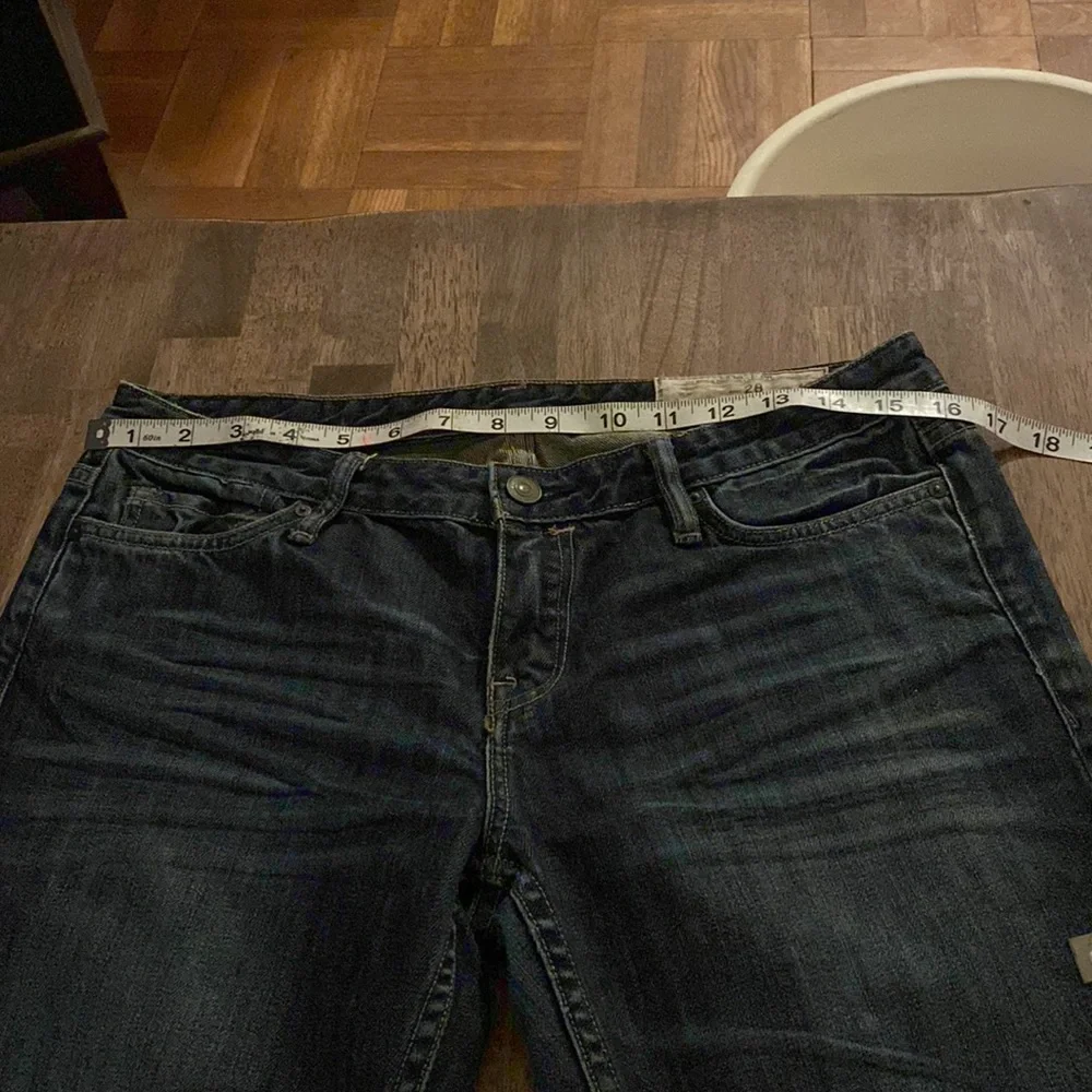 All Saints Spitalfields Jack’s Place skinny dark blue jeans from Neiman Marcus